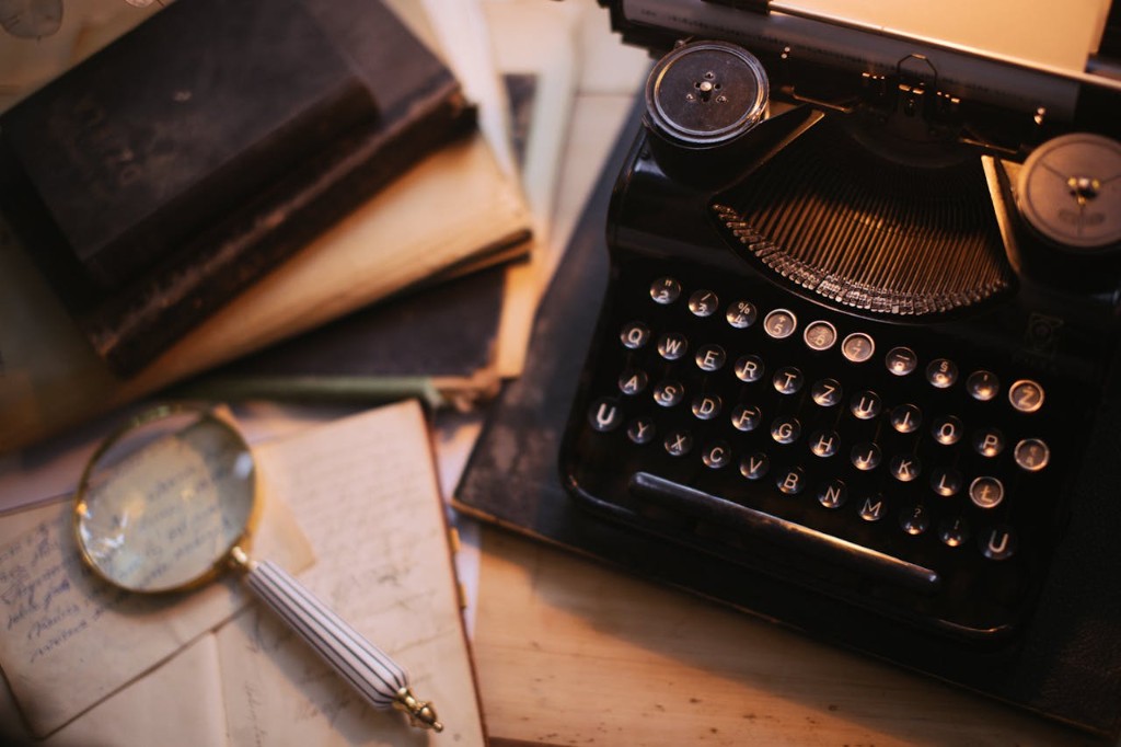Typewriter and magnifying glass